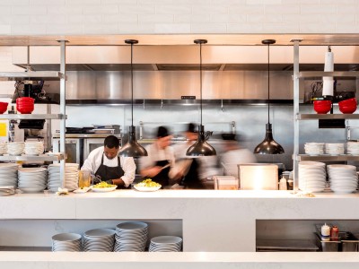 The open kitchen inside Wolfgang Puck Kitchen + Bar